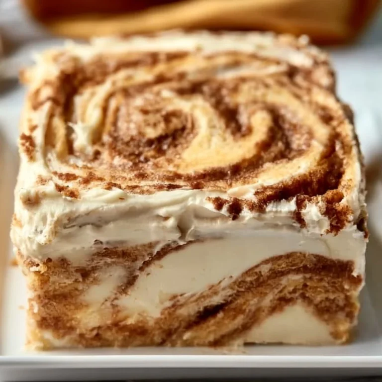 Delicious homemade cinnamon roll cake with creamy glaze and cinnamon swirls